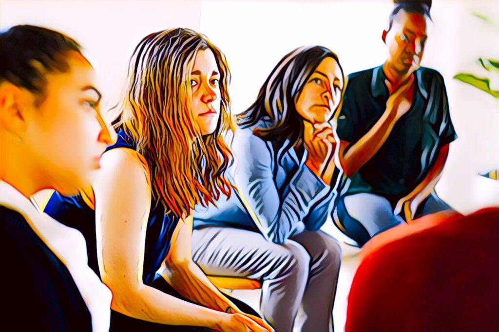 Group of women sitting and listening intently.